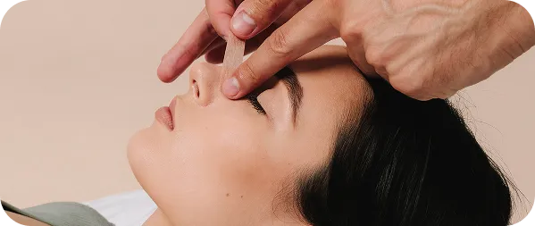 surgeon inspecting nasal bridge