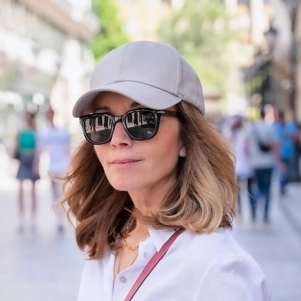 woman wearing hat and sunglasses