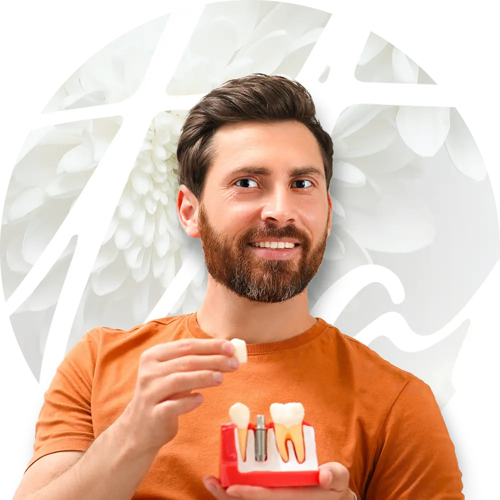 man holding dental implants