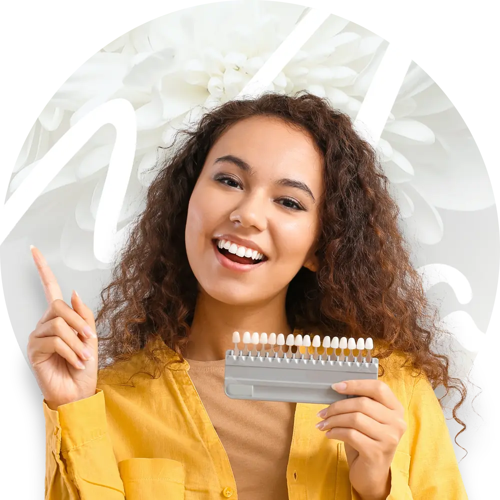 woman holding dental shade guide