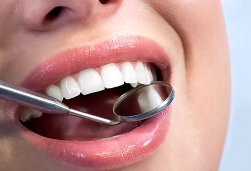 Woman getting oral cancer screening