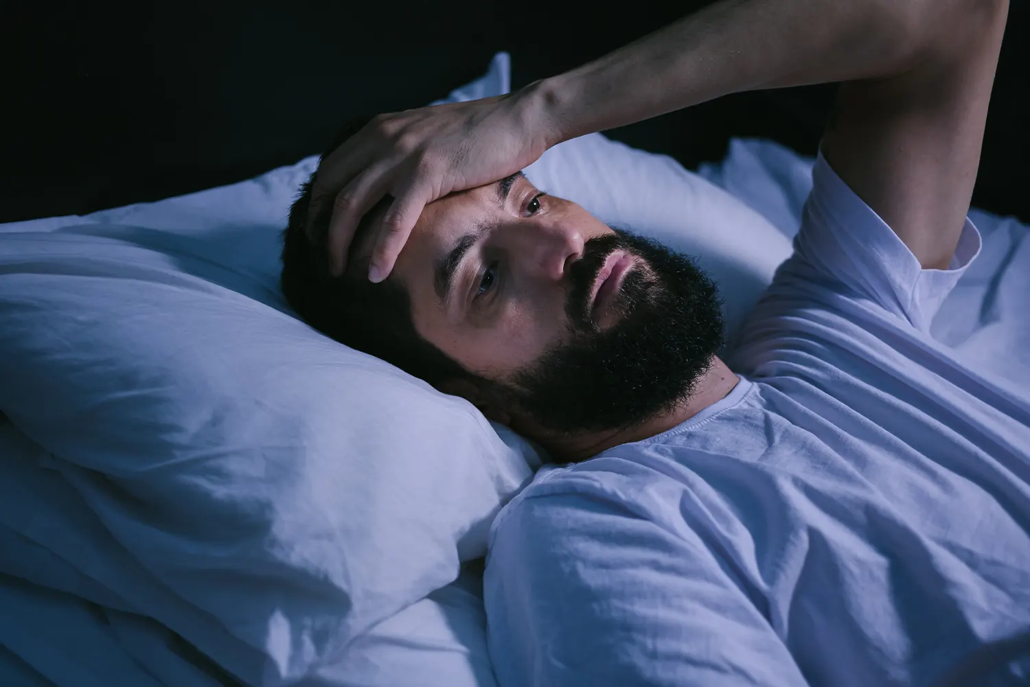 guy with beard in bed