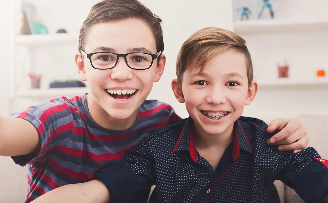 two young boys smiling
