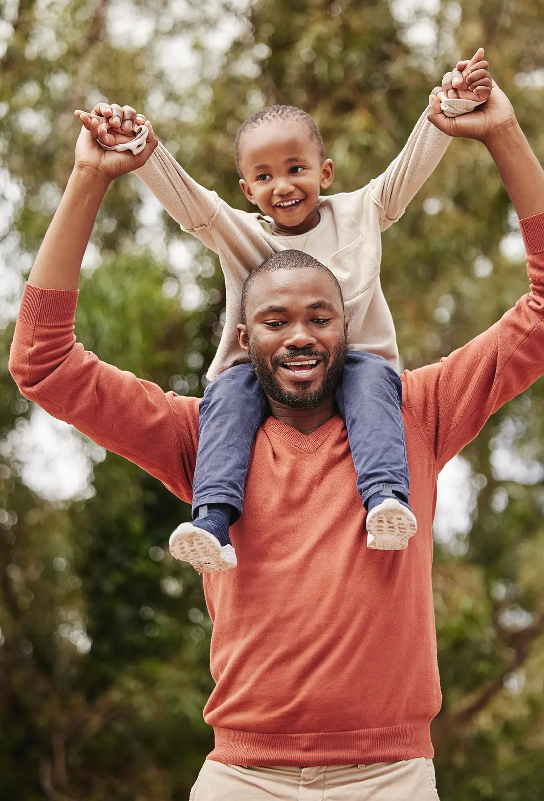 man and kid smiling