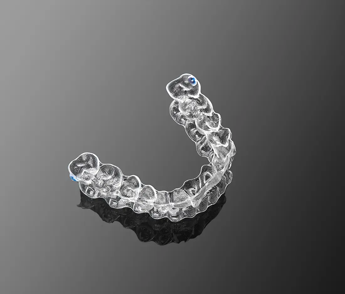 invisalign tray on black background