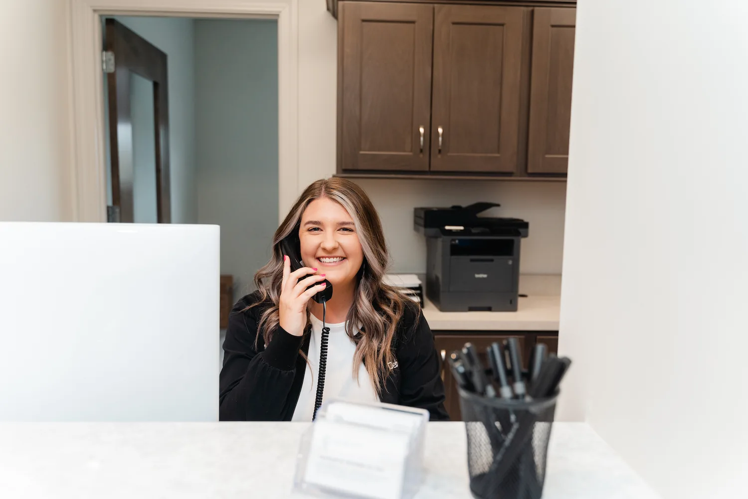 woman on phone smiling